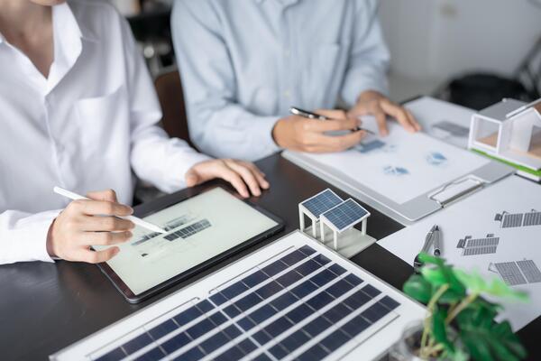 LivWarm energy consultant discussing solar solutions with a UK homeowner.